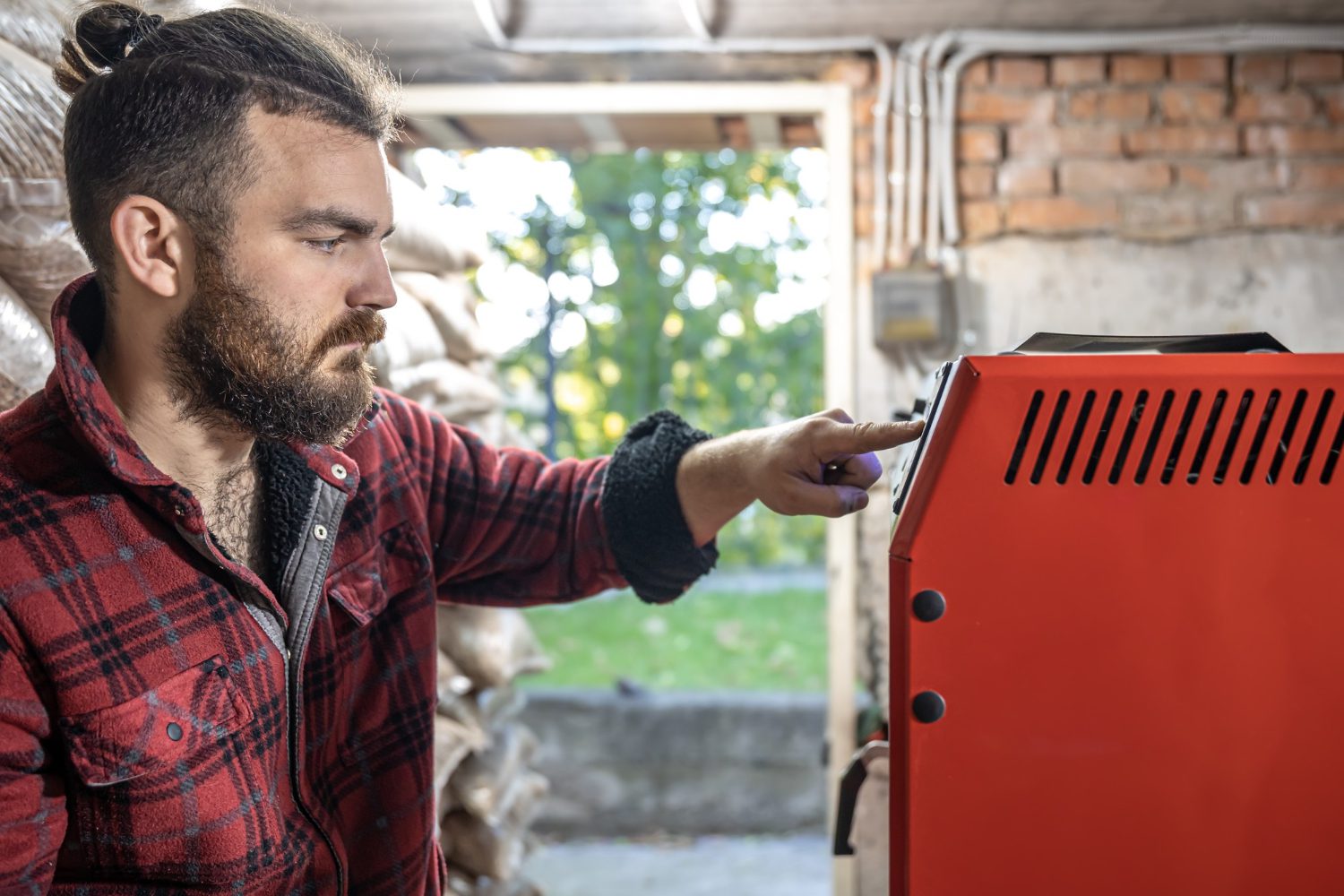 young-man-room-with-solid-fuel-boiler-working-biofuel-economical-heating